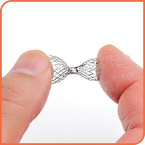 Image of the Shockwave Reducer device being held between two fingers. The metal device has a honeycomb pattern in an hourglass shape.